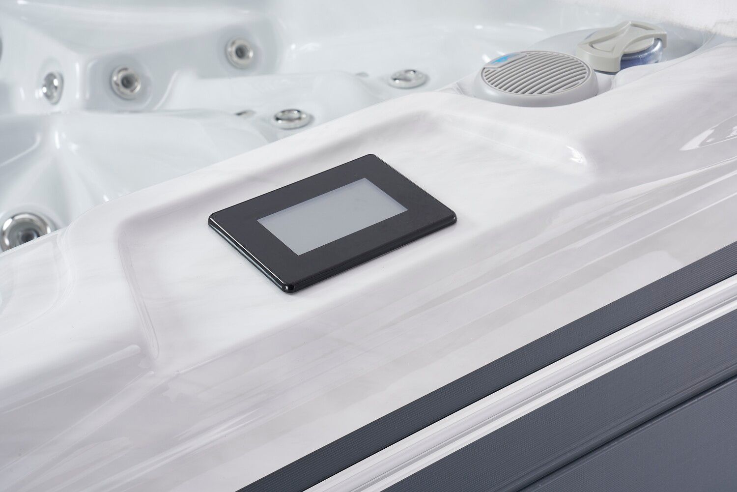 Hot tub with a digital control panel, white interior.