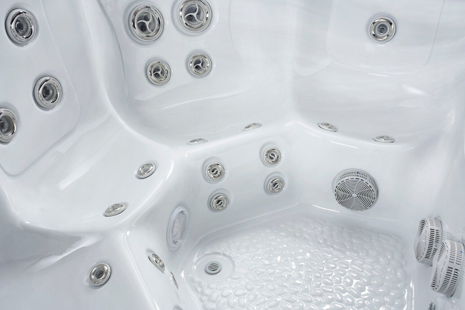 White hot tub interior with multiple water jets.