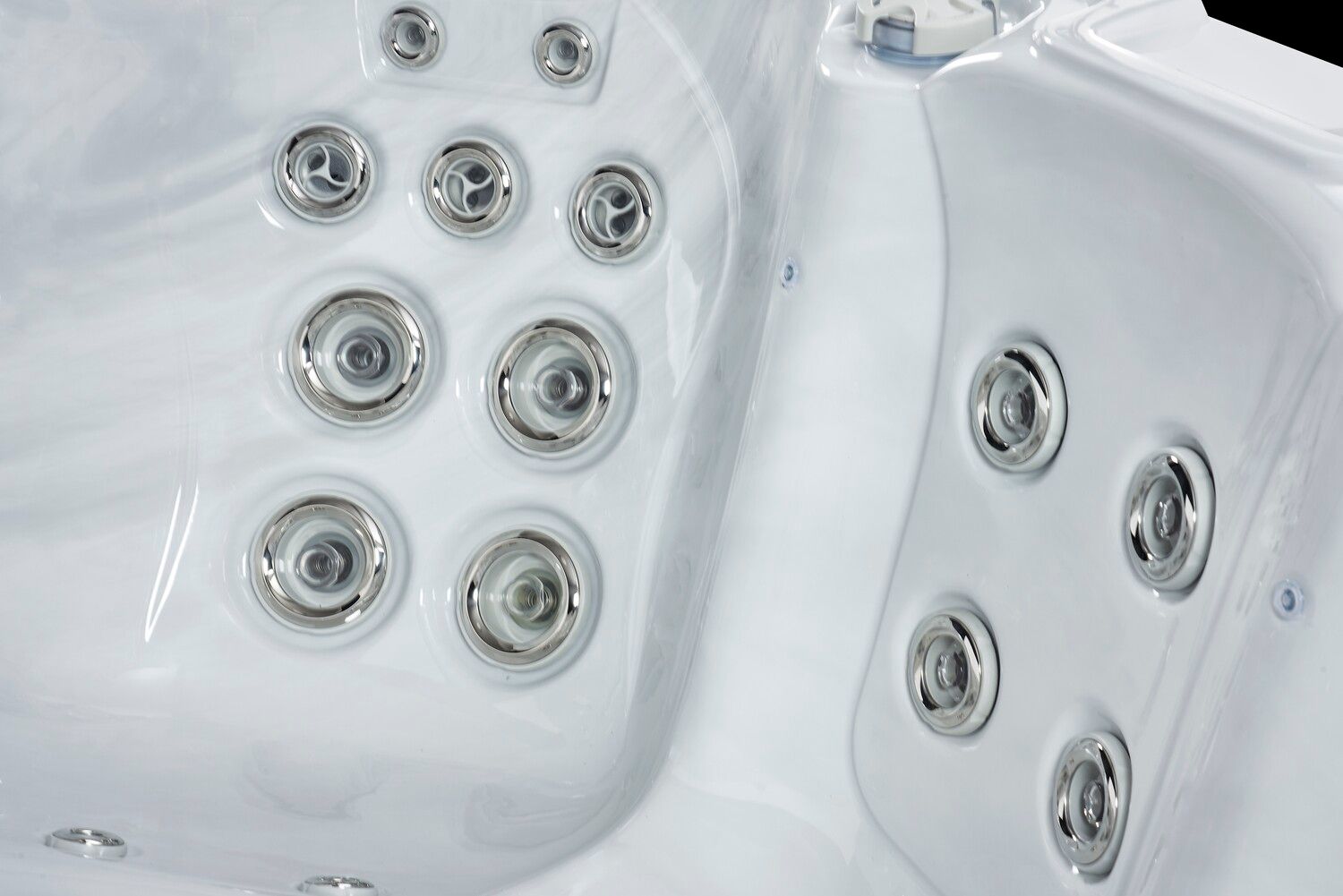 White hot tub interior with several jets.