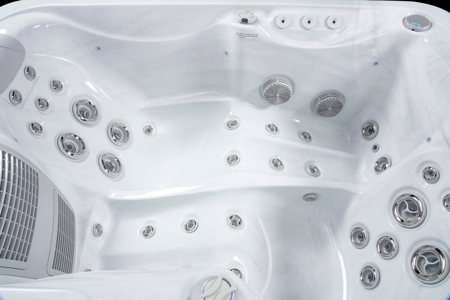 White hot tub interior with many jets.