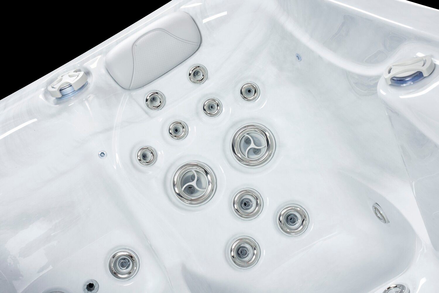 White hot tub interior with several jets and controls.