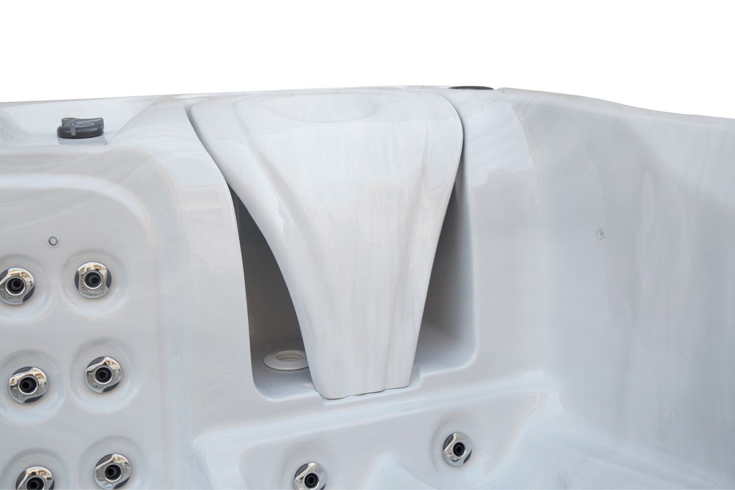 Close-up of a white hot tub interior featuring a waterfall feature and jet nozzles.