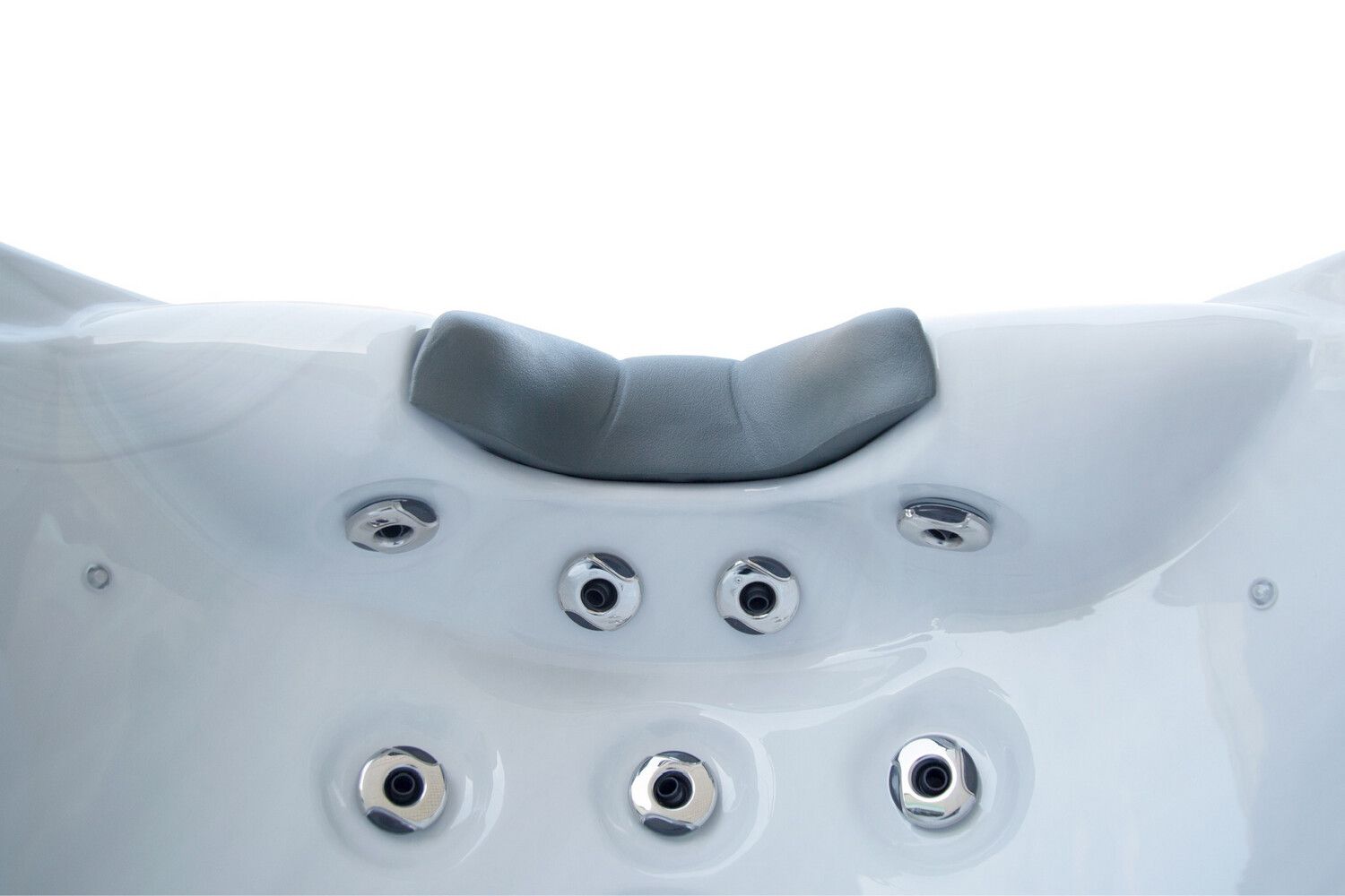 White hot tub with gray headrest and jets.