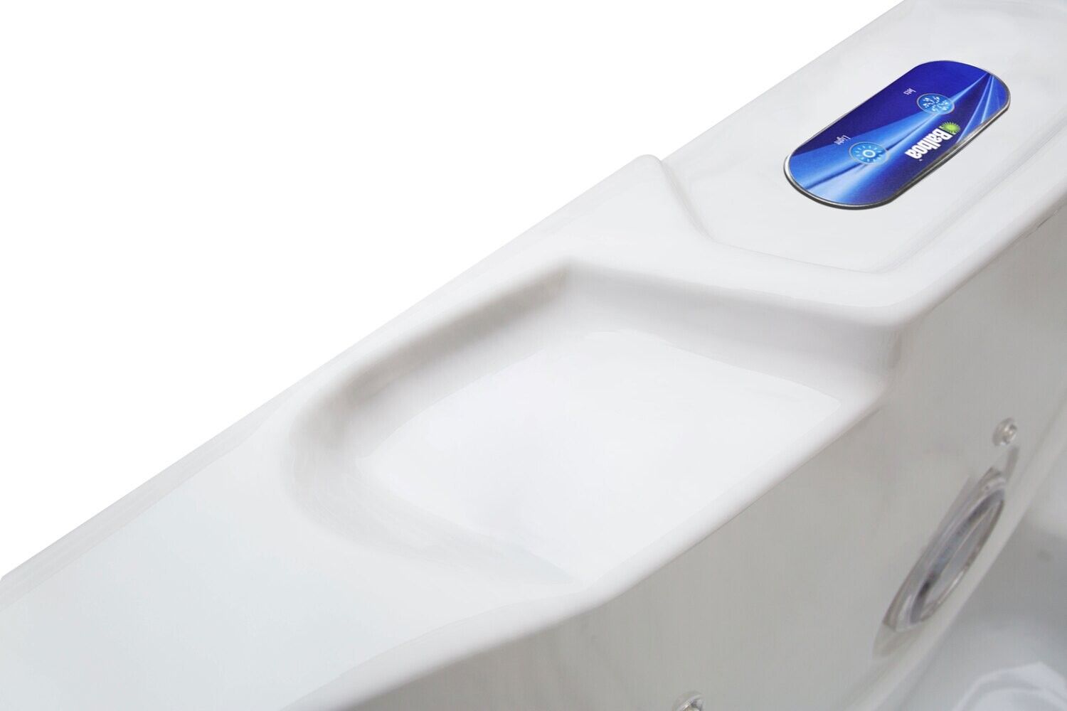 Close-up of a white hot tub rim with a molded-in section and a control panel.