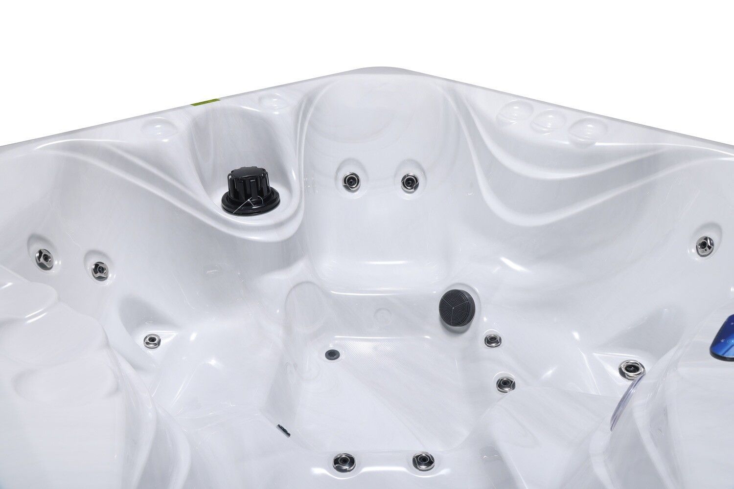 White hot tub interior with jets and control knobs.
