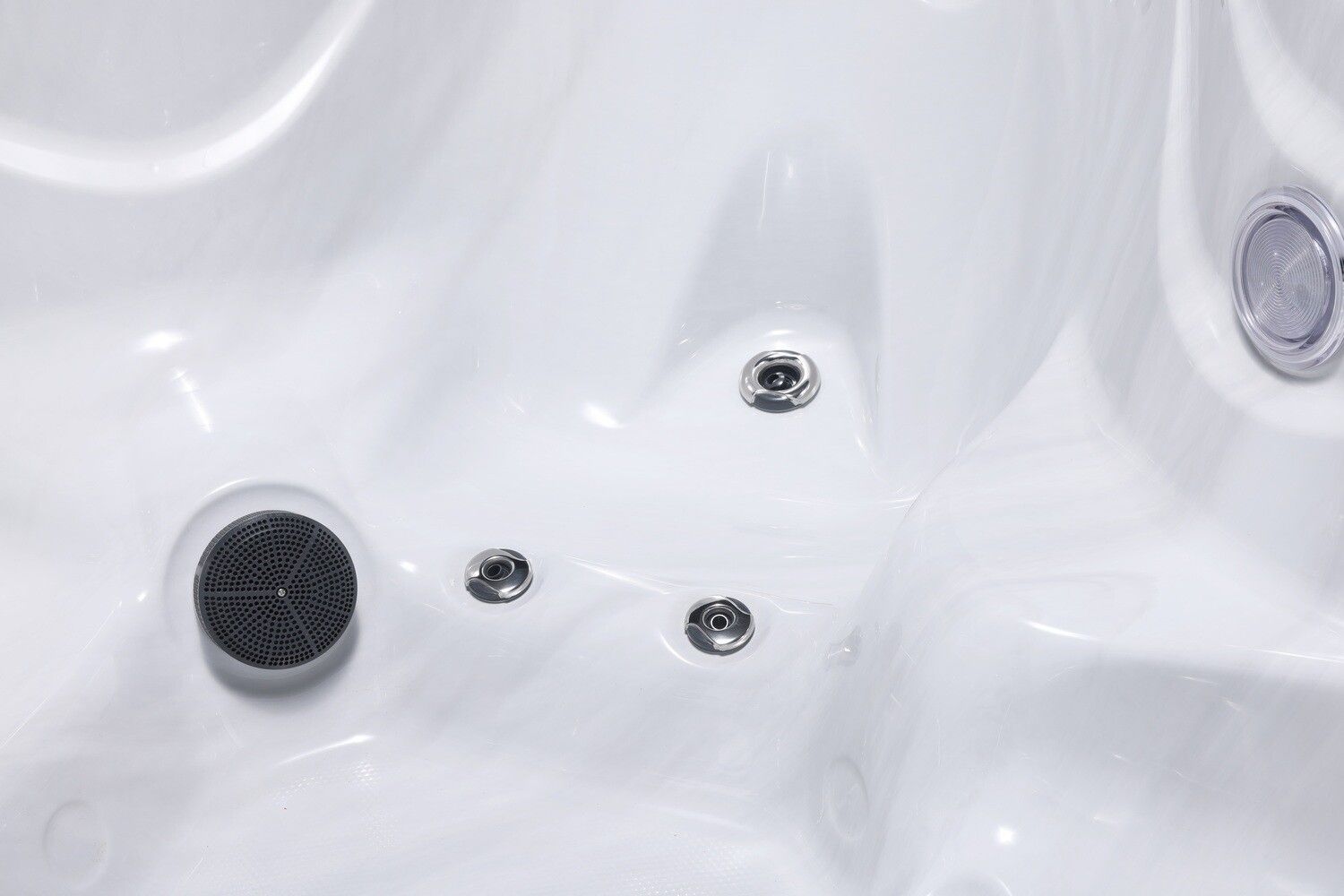 White hot tub interior with jets and a filter.