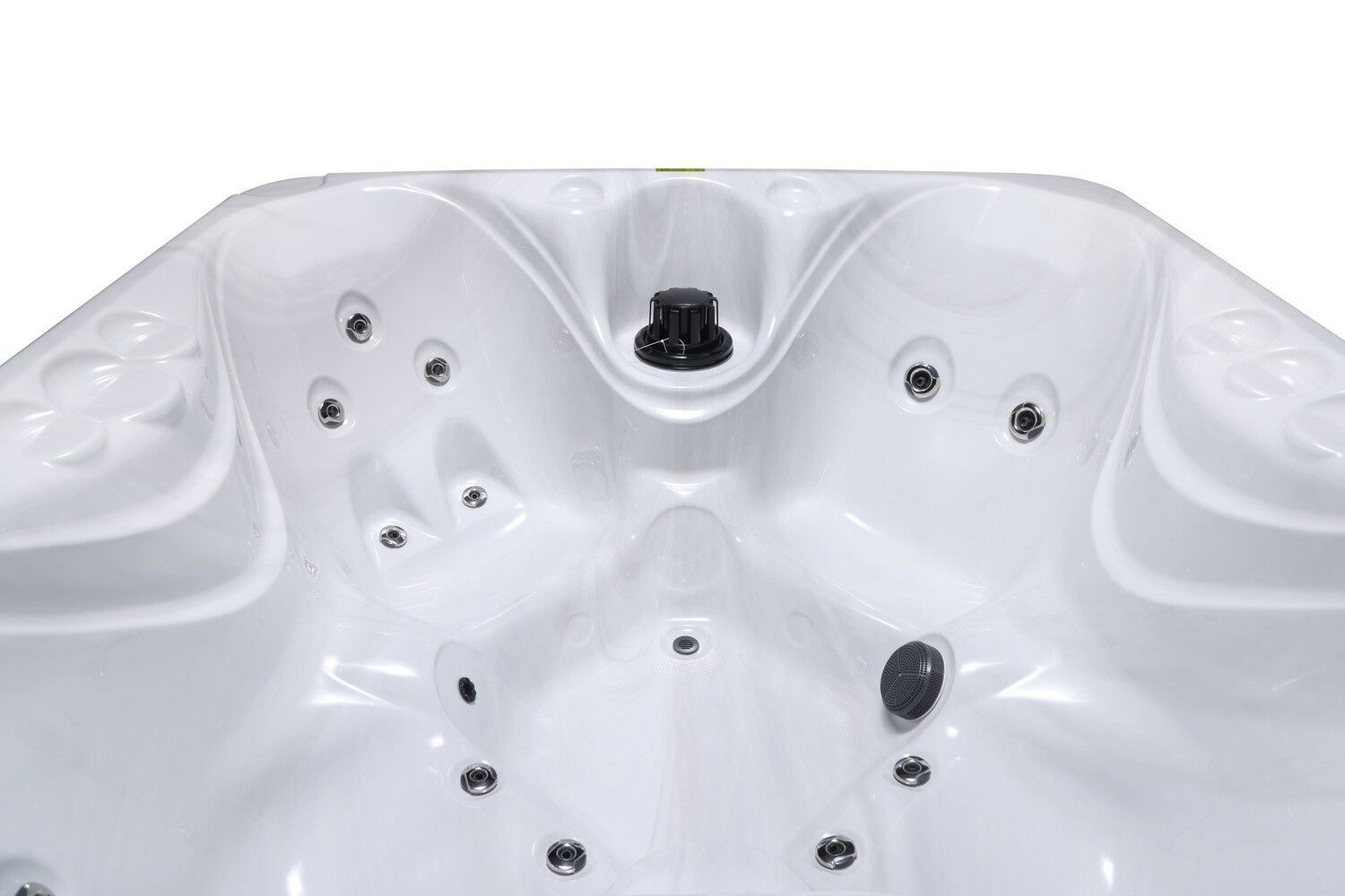 Close-up of a white hot tub interior with several jets and a center control knob.