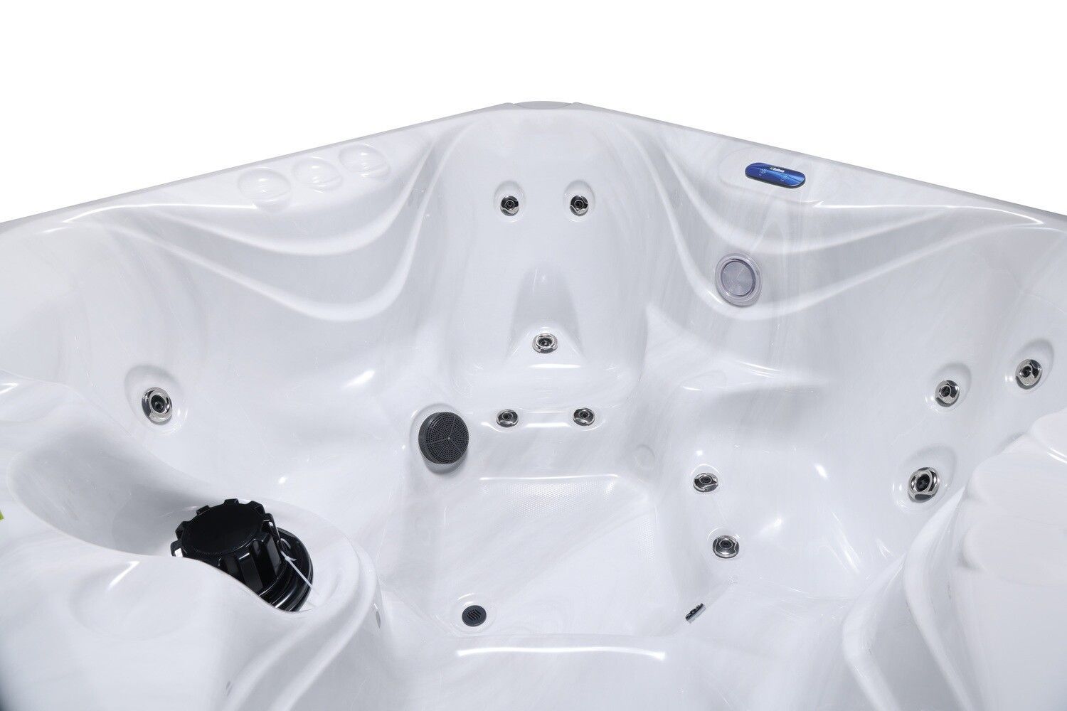 White hot tub interior with jets and control knobs.