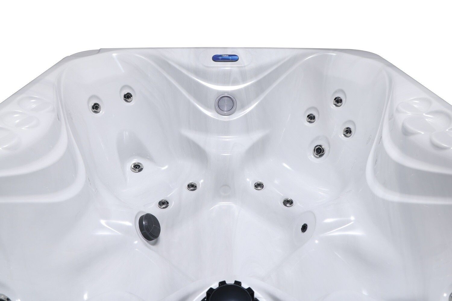 Overhead view of a white hot tub interior with several jets.