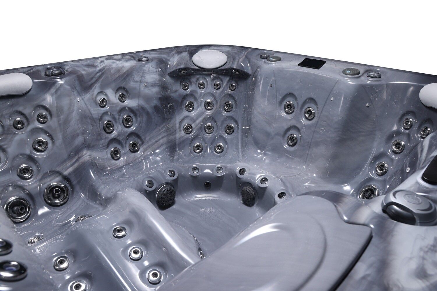 Close-up view of the interior of a gray hot tub with multiple jets and molded seating.