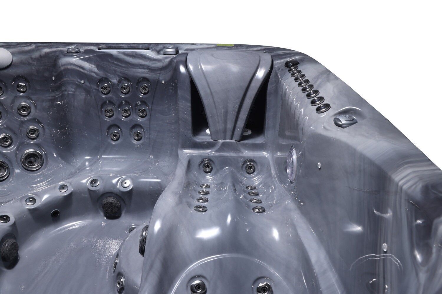Close-up of a gray hot tub interior with jets and a waterfall feature.