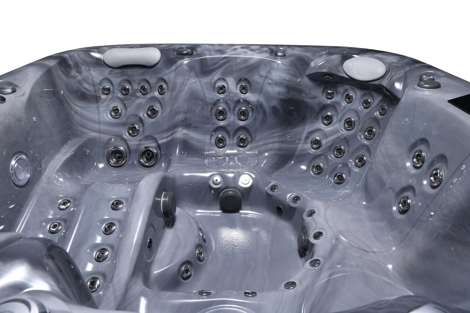 Close-up of a gray hot tub interior with many jet nozzles, seats, and a marbled pattern.