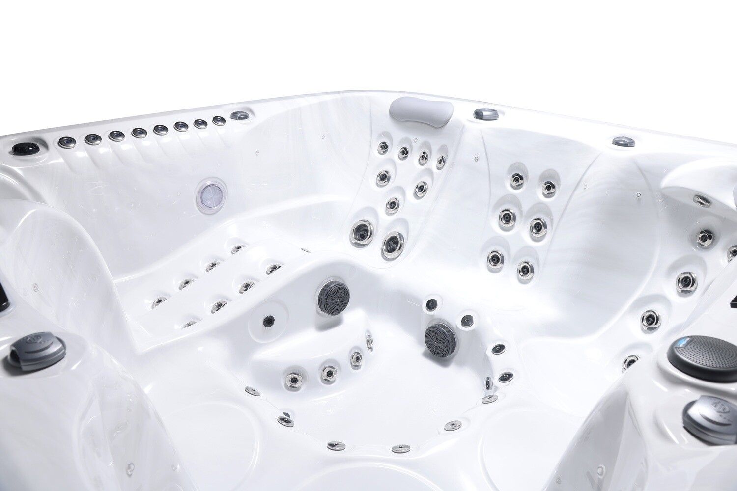 White, empty hot tub interior with various jets and seating areas.