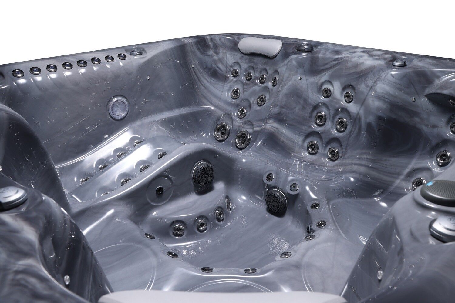 Gray hot tub interior with numerous jets and seating.