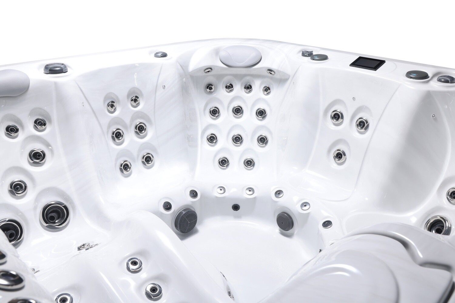 Close-up view of a white, multi-person hot tub interior with several jet nozzles.