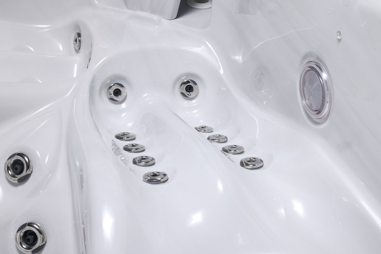White hot tub interior with several water jets.