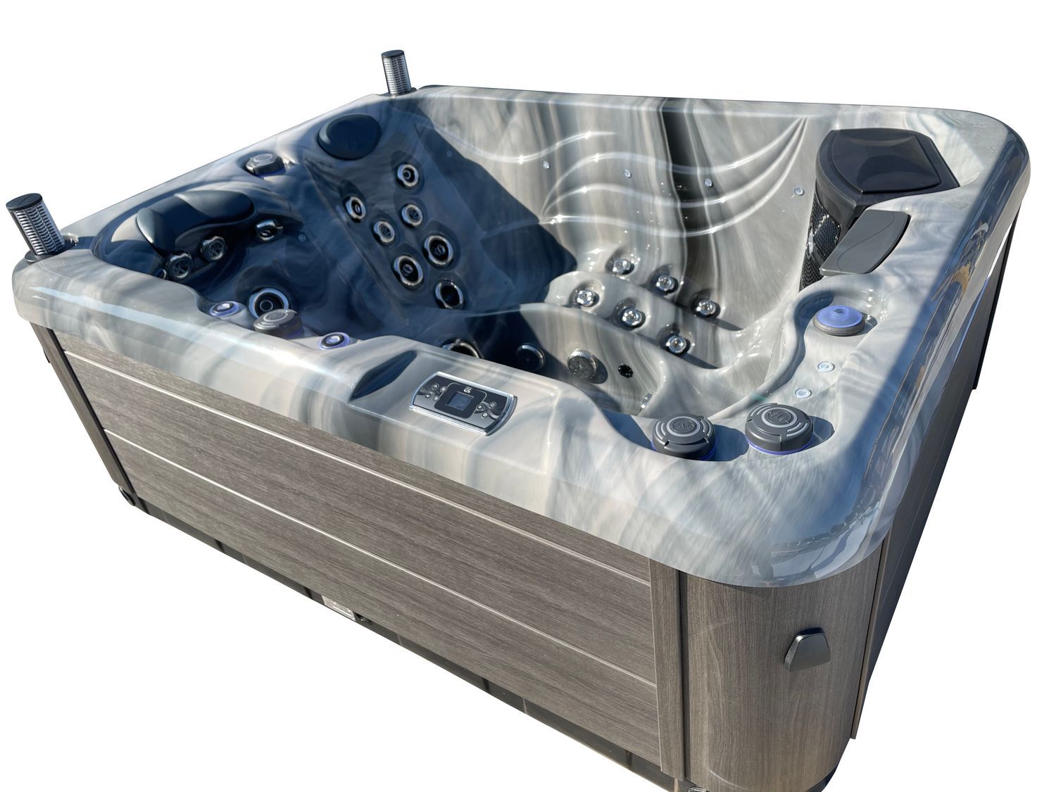 Gray and white marbled hot tub with gray cabinet, set outdoors.