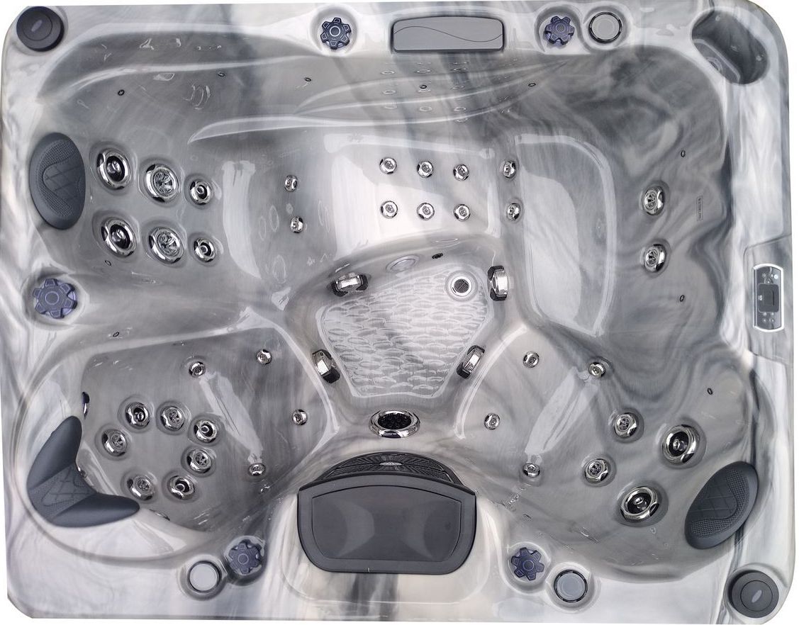 Overhead view of a gray and white marble-patterned hot tub with multiple jet nozzles.