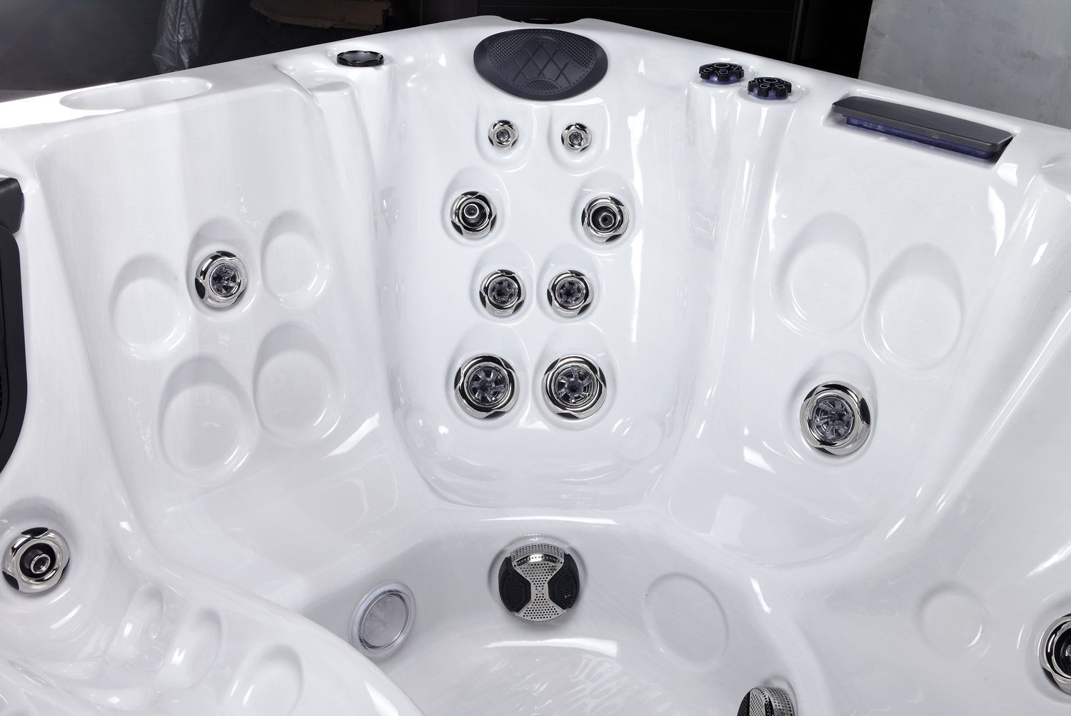 White hot tub interior with several water jets.