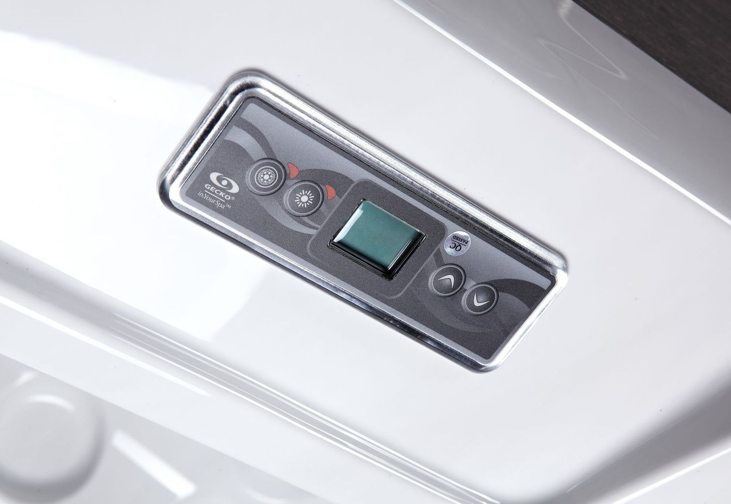 Jacuzzi control panel with LCD screen and buttons, mounted on white surface.