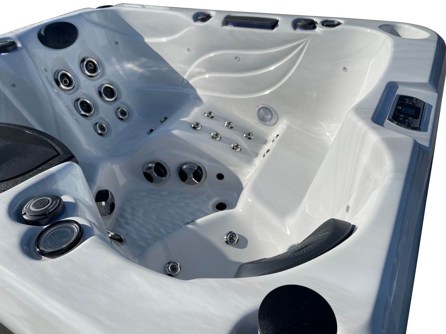 White hot tub interior with multiple jets and seating areas.