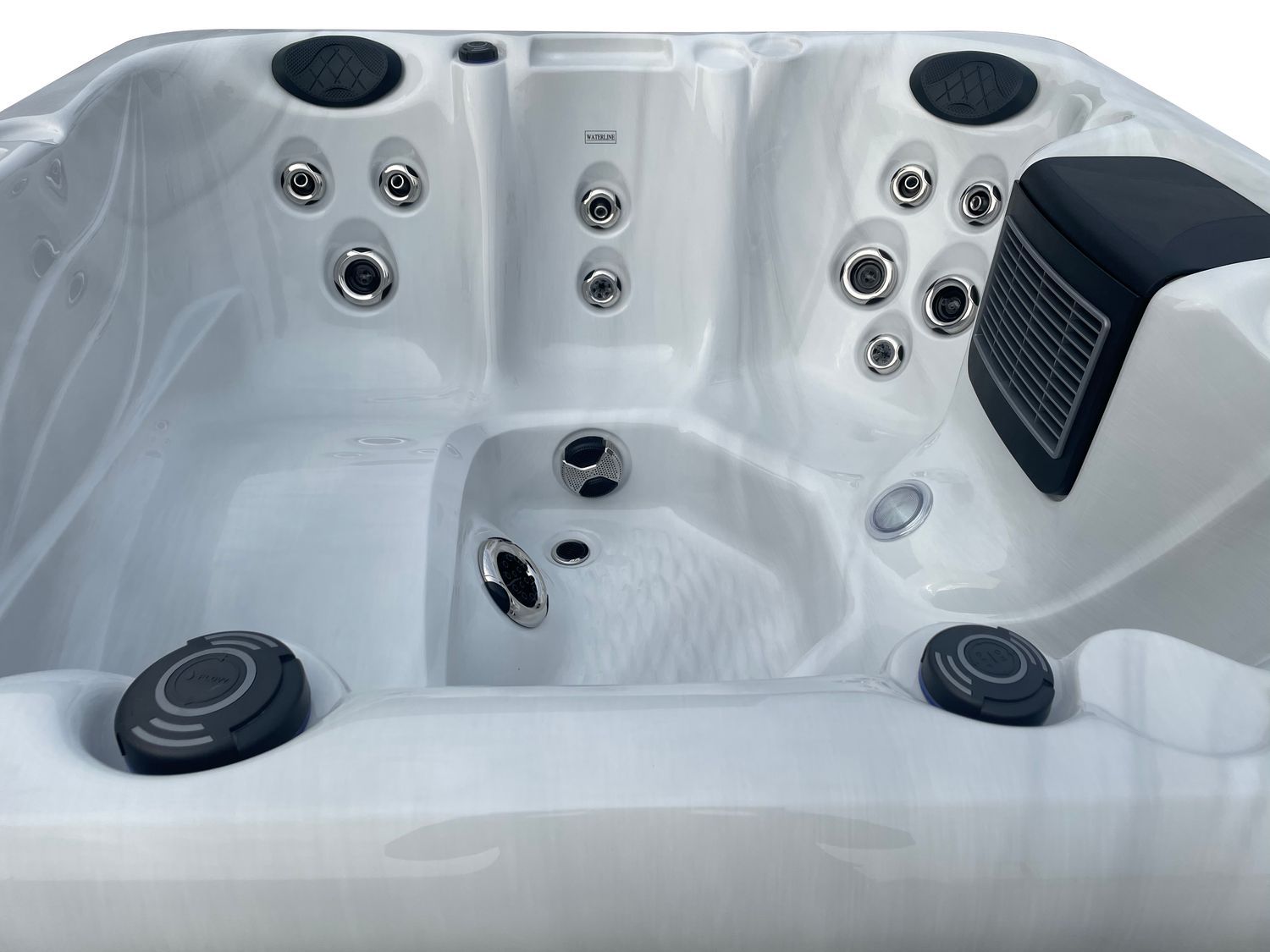 White hot tub interior with jets and headrests.