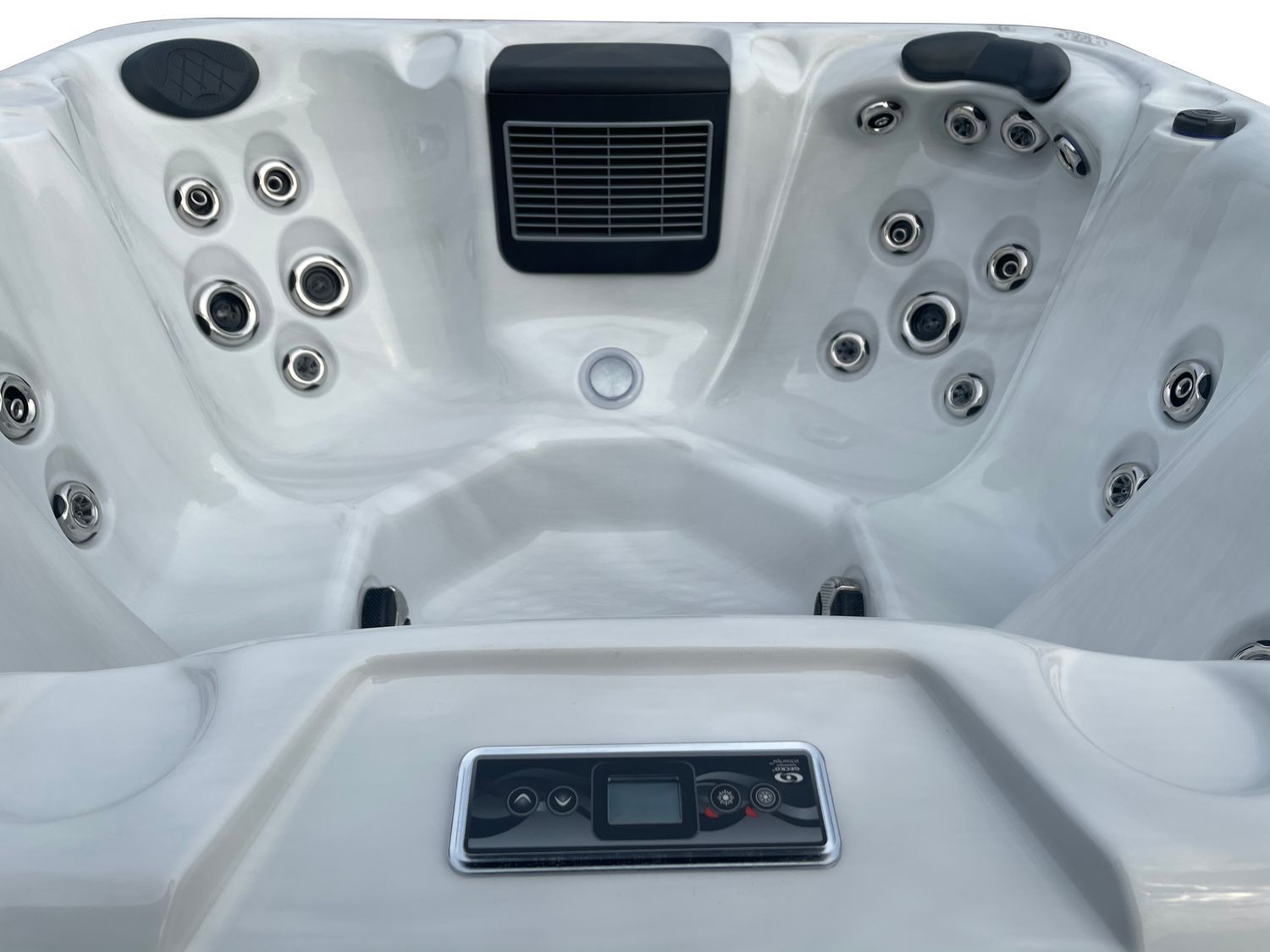 White hot tub interior with jets, control panel, and vent.