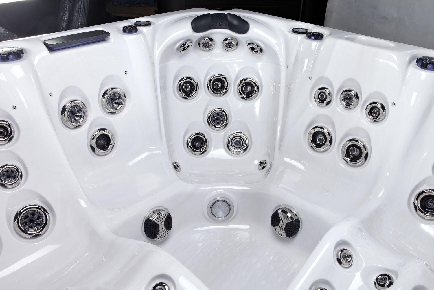 White hot tub interior with numerous jets.