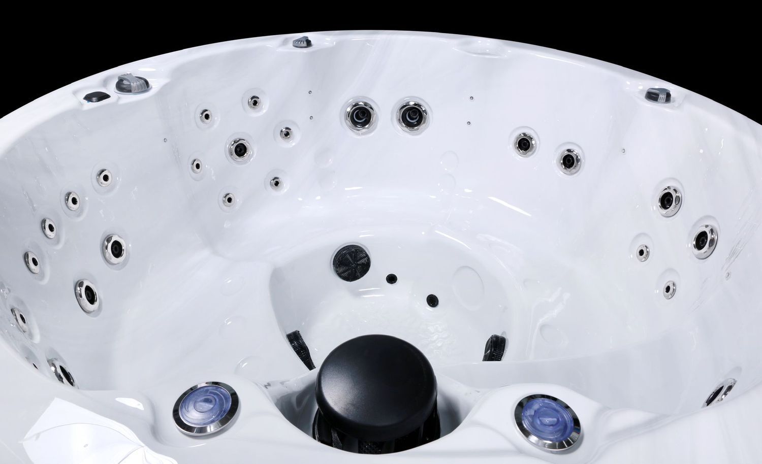 White hot tub interior with multiple jets, against a black background.