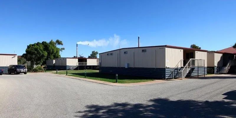 A Group Of Mobile Homes Are Sitting Next To Each Other In A Parking Lot — Leichhardt Accommodation in Mornington, QLD