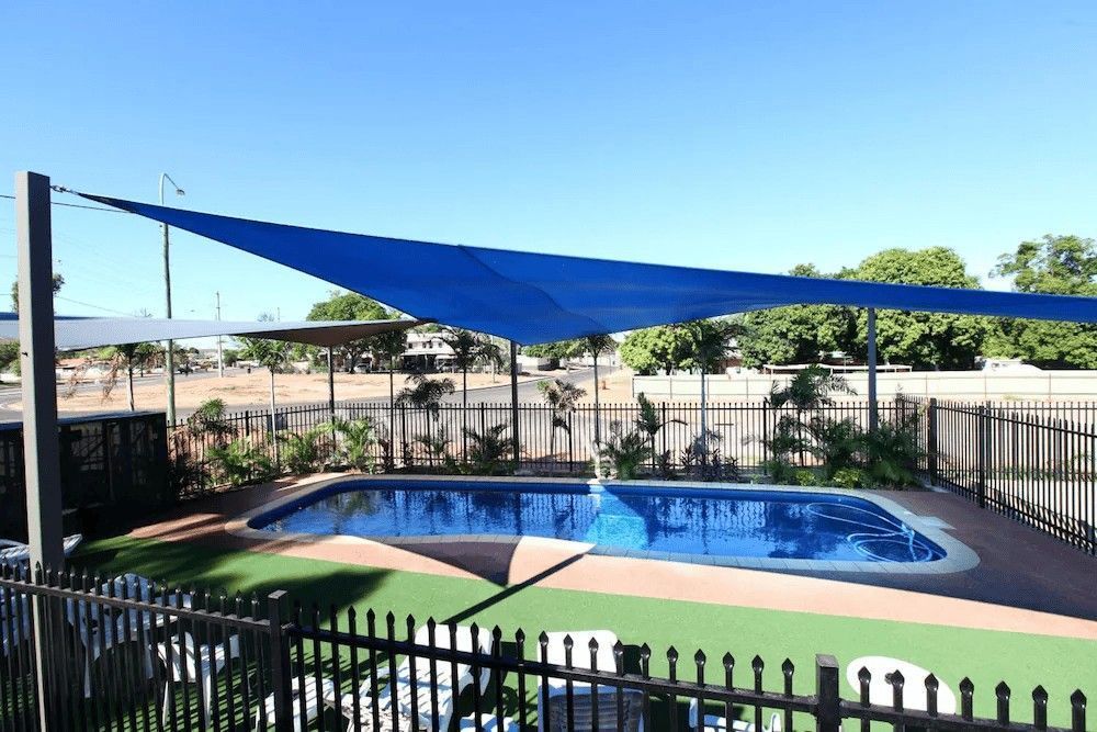 Swimming Pool with Blue Shade Sail — Leichhardt Accommodation in Mornington, QLD