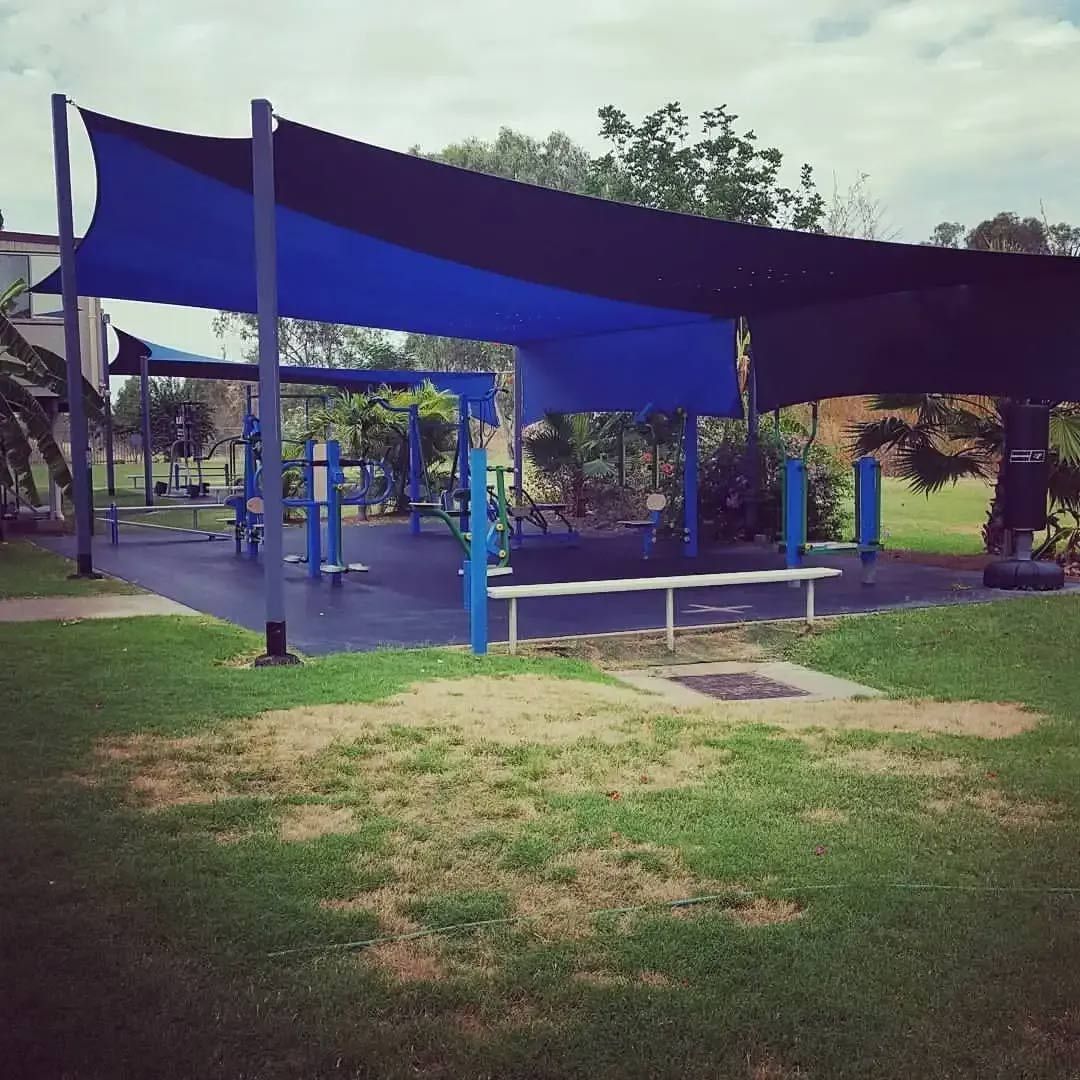A Playground With A Blue Canopy Over It — Leichhardt Accommodation in Mornington, QLD