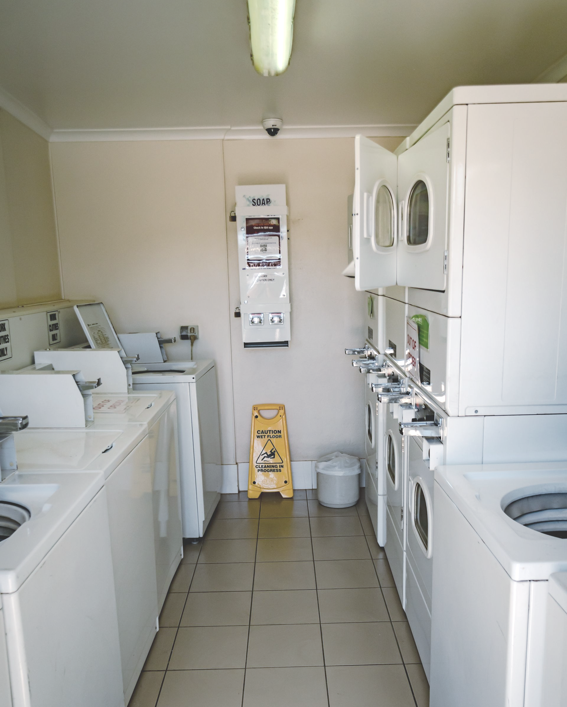 Laundry Room with Washer, Dryer, Sink, Cabinets, and A Small Window — Leichhardt Accommodation in Mornington, QLD