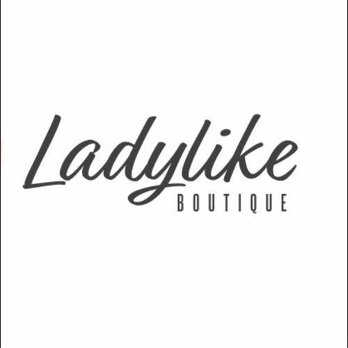 A black and white logo for a boutique called ladylike boutique.