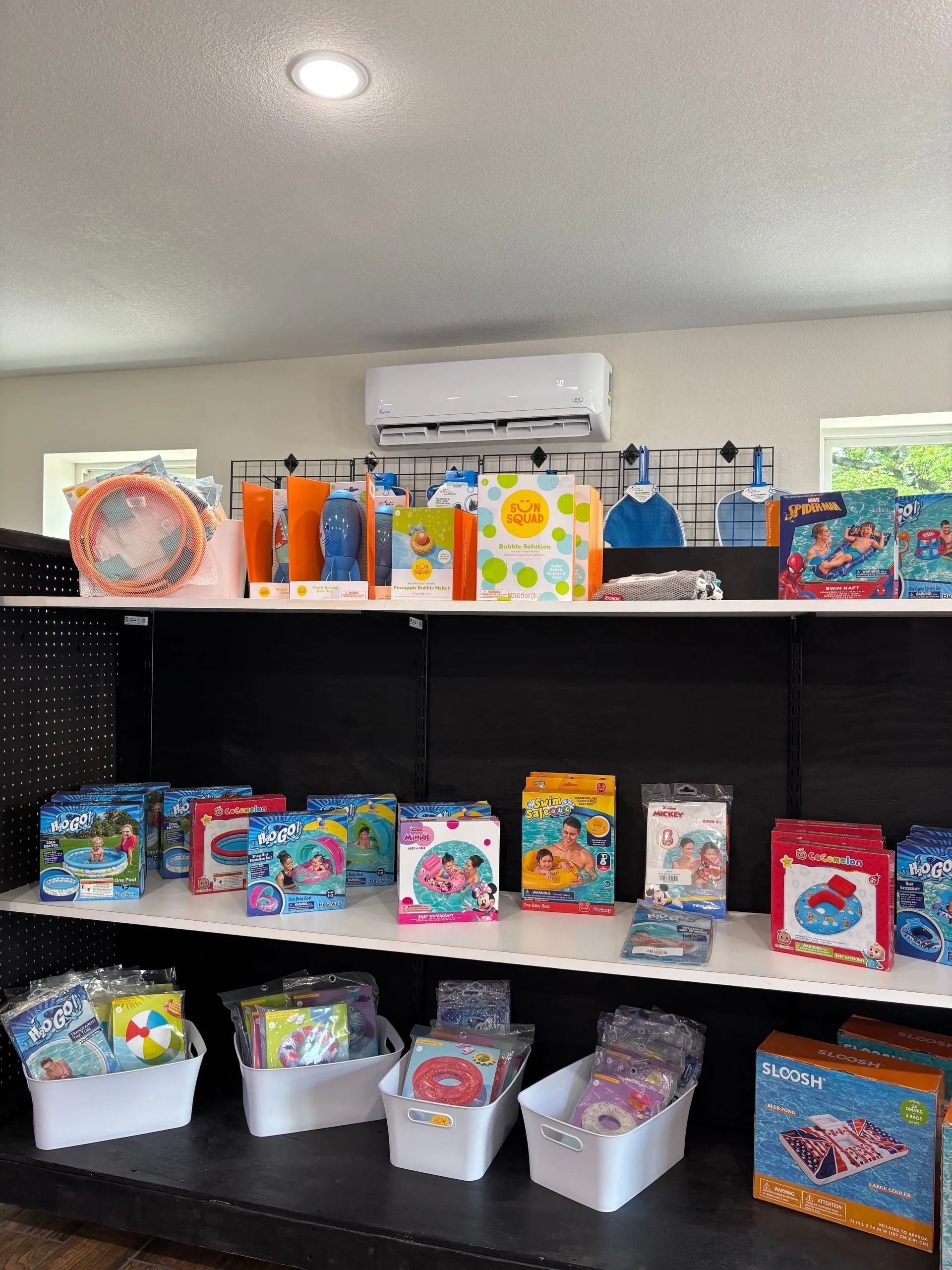 Shelves filled with colorful snack and candy boxes in a store display