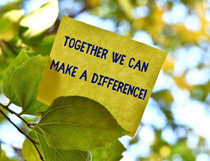 Yellow sticky note on leaves with text: