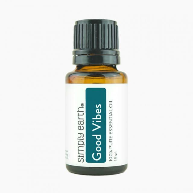 A bottle of simply earth good vibes essential oil