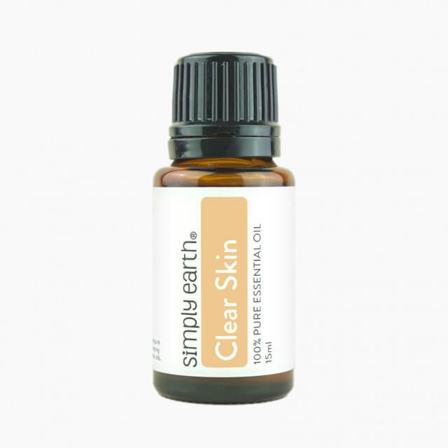 A bottle of simply earth clear skin essential oil