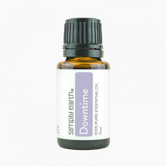 A bottle of simply earth downtime essential oil
