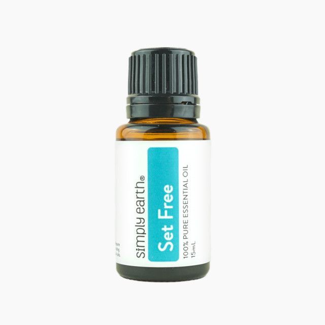 A bottle of simply earth set free essential oil