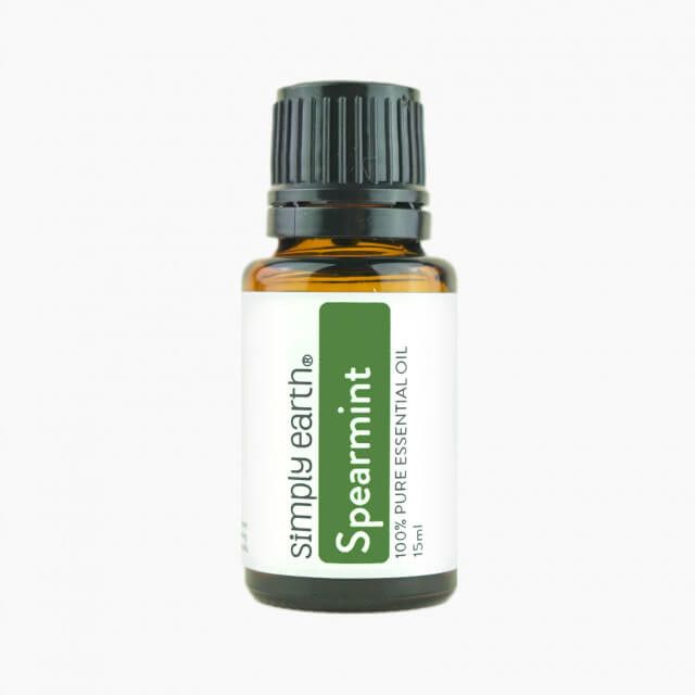 A bottle of spearmint essential oil from simply earth