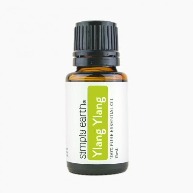 A bottle of simply earth ylang ylang essential oil