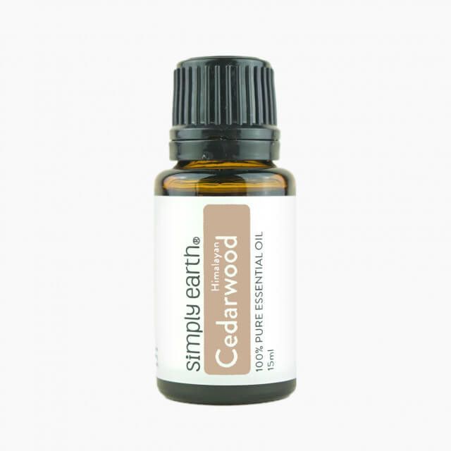 A bottle of simply earth cedarwood essential oil