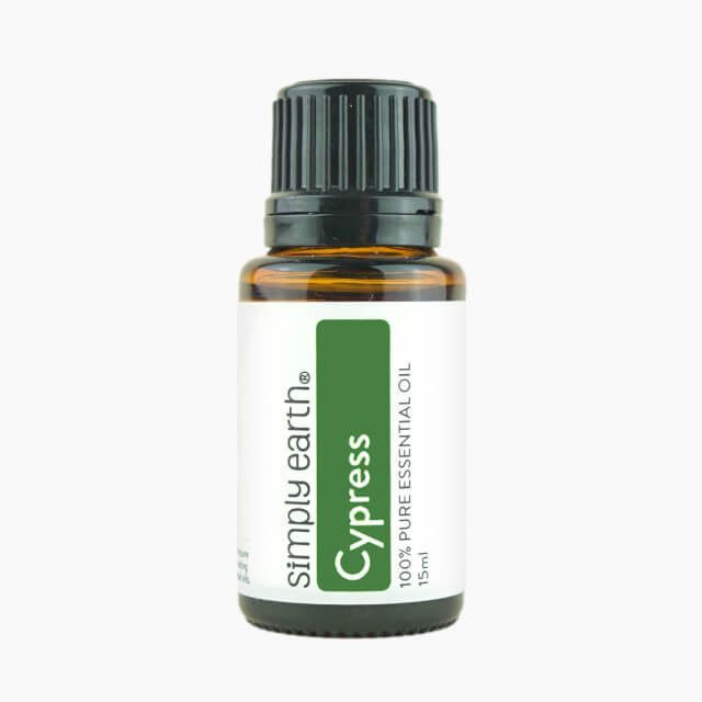 A bottle of simply earth cypress essential oil
