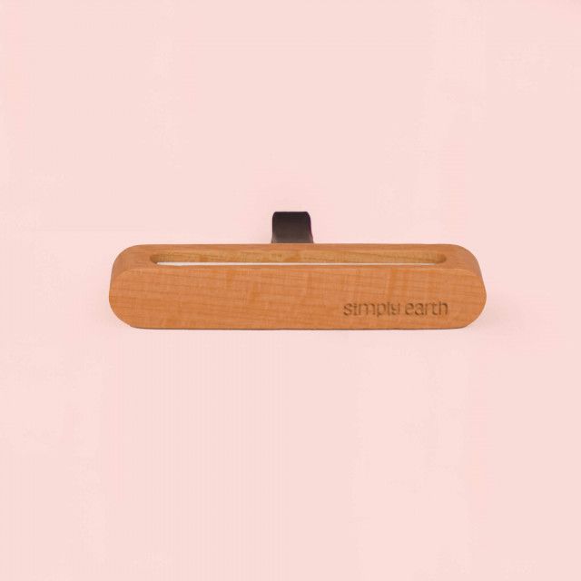 A wooden object with the word bottle on it