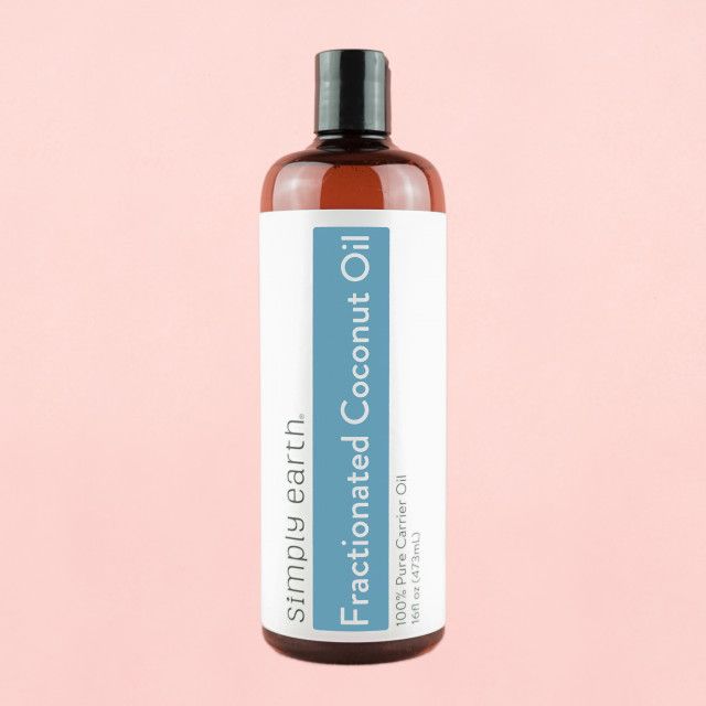 A bottle of fractionated coconut oil from simply earth