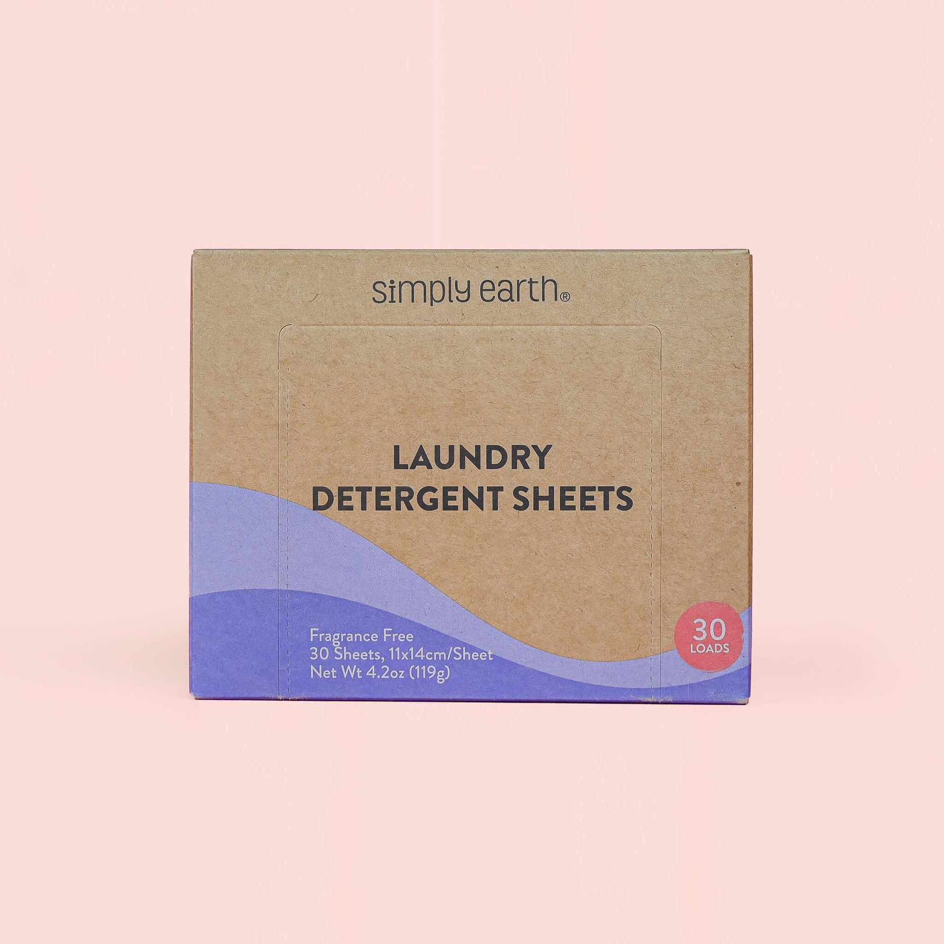 A box of laundry detergent sheets on a pink background.