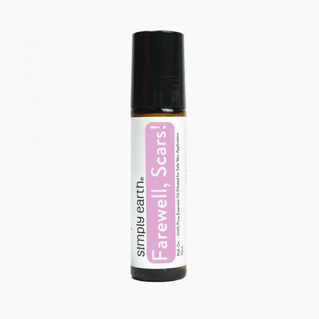A bottle of simply earth farewell scars essential oil