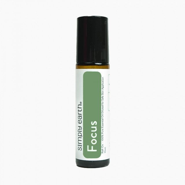 A bottle of simply earth focus essential oil