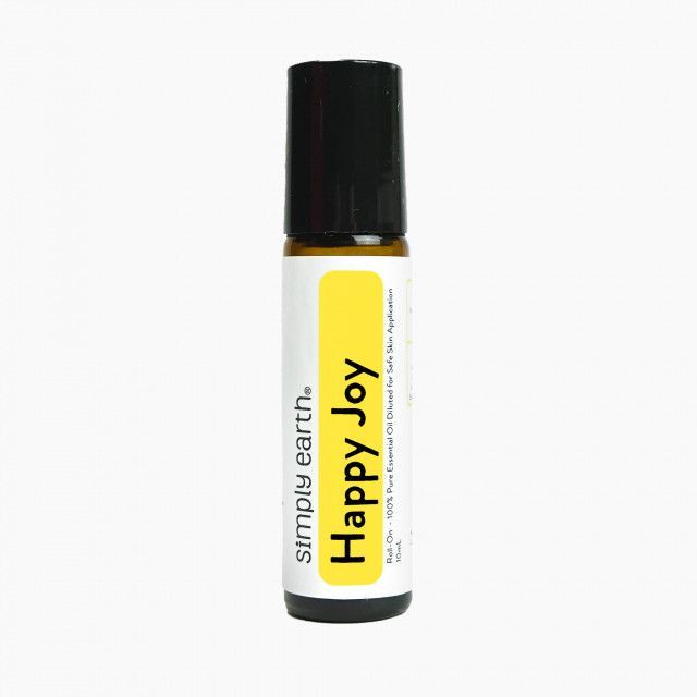 A bottle of simply earth happy joy essential oil